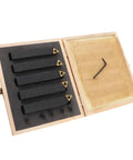 Five-piece carbide turning tool set with indexable inserts in a wooden case; black tools with gold carbide tips.