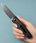 Hand holding Go To EDC Folding Knife With Aluminum Handle, Ultra Lightweight 60G, 7 Cm Reverse Tanto Blade, Stonewashed Finish.
