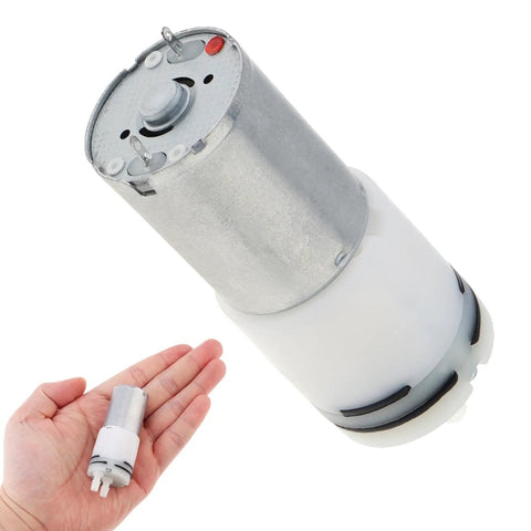 Hand holding Two Pack R370 Micro Water Pump Motor With 3.7V DC Power, Tiny Suction Diaphragm Pump, Self Priming Mini Water Pump