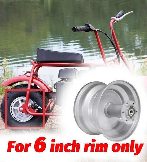 Compact mini bike next to water with focus on 6-inch rim, compatible with Beefy 50T Balanced Rear Chain Sprocket for power transfer.
