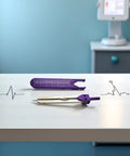 ECG Calipers Measuring Tool For Nurses And Docs with purple accent on table with electrocardiogram background in clinical setting