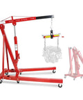 Rock Solid Engine Hoist And Folding Hydraulic Crane Featuring Six Low Friction Casters Built In Leveler Tilt Control And Heavy Duty Steel Shop Workhorse Handling 2 Ton 4400 Lbs Loads with an engine attached.