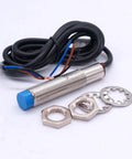 Inductive Proximity Sensor 4mm Sensing Distance, Two Pack, NPN NC Output with cable and metal cylinder housing, part components shown.