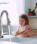 Universal Kitchen Faucet Head Replacement With Fifteen Adapter Kit, Chrome finish in kitchen setting, water streaming.