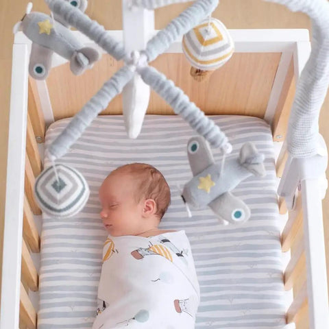 Up Up And Away Musical Baby Crib Mobile For Boys With Sky Balloons Clouds And Planes Calming Lullabies Soother Featuring 12 Soothing Tunes Lil Nursery Decor Gift shown over sleeping baby