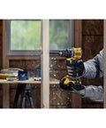 No Fuss Hella Slick 20V Max Brushless Cordless Drill Driver Kit With Compact Atomic Frame drilling into wood.