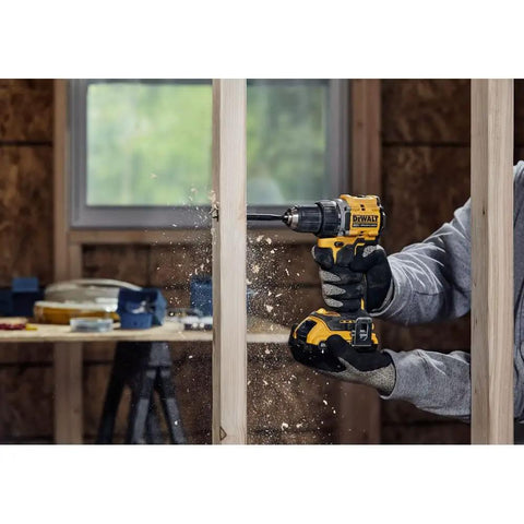 No Fuss Hella Slick 20V Max Brushless Cordless Drill Driver Kit With Compact Atomic Frame drilling into wood.