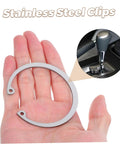 Hand holding a Five Piece Stainless Steel C Clips Kit For Grooved Shafts next to car shifter inset.