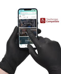 Dang Tough Heavy Duty Black Nitrile Gloves Six Mil Thick Flexible Shell With Textured Grip And Latex Free Powder Free Finish Built For Kitchen Meal Prep handling a touchscreen mobile device.