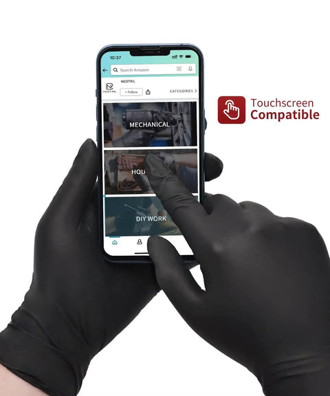Dang Tough Heavy Duty Black Nitrile Gloves Six Mil Thick Flexible Shell With Textured Grip And Latex Free Powder Free Finish Built For Kitchen Meal Prep handling a touchscreen mobile device.