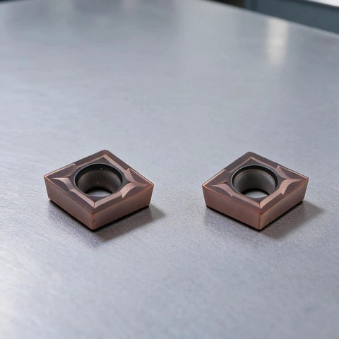 Premium Lathe Turning Tool Set With SCMCN1010H06 Holder And Ten CCMT060204 Carbide Inserts, two CCMT060204 inserts on metal surface.