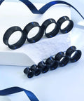 Set of black silicone ear gauges for stretching ranging from 4mm to 20mm, displayed on a white background. Silicone Ear Gauges And Plugs Kit For Ear Stretching Black Invisible Rings Tunnels For Men And Women Starter Expander Set With Multiple Sizes 4mm To 20mm