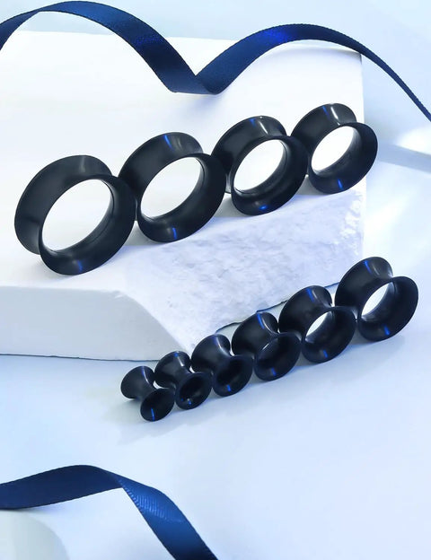 Set of black silicone ear gauges for stretching ranging from 4mm to 20mm, displayed on a white background. Silicone Ear Gauges And Plugs Kit For Ear Stretching Black Invisible Rings Tunnels For Men And Women Starter Expander Set With Multiple Sizes 4mm To 20mm
