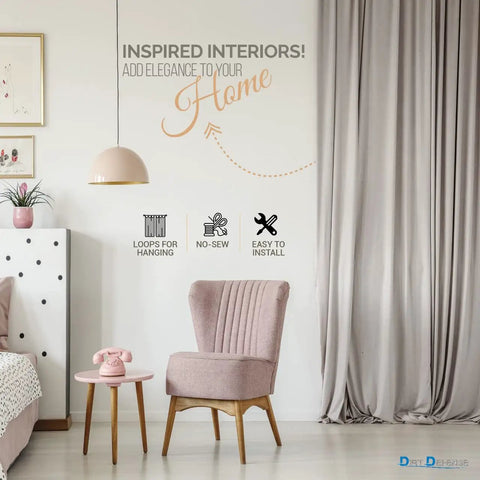 Elegant living room with pink chair, side table, pink pendant lamp, and beige curtains showcasing home decor elegance.