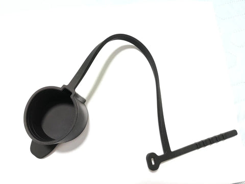 Keep Your Rig Running Smooth With This Hella Reliable EV Charger Plug Port Cover Featuring Quick Zip Tie Mounts And An All Season J1772 Dust Cap. Black rubber dust cap with zip tie mount.