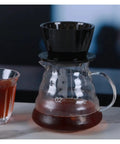 Straight Fire Premium Glass Pour Over Coffee Dripper Boasts Crystal Eye Viewing Window Holds One To Two Cups on a counter.