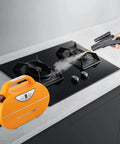 Person using Powerful 1800W Steam Cleaner With High Pressure And High Temperature Steam For No Hassle Deep Clean And Easy Cleanup on stove