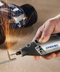 Heavy Duty 130 Watt Rotary Multi Tool Powerhouse Offering Variable Speed Control From 10000 To 33000 Rpm with sparks and metal cutting.