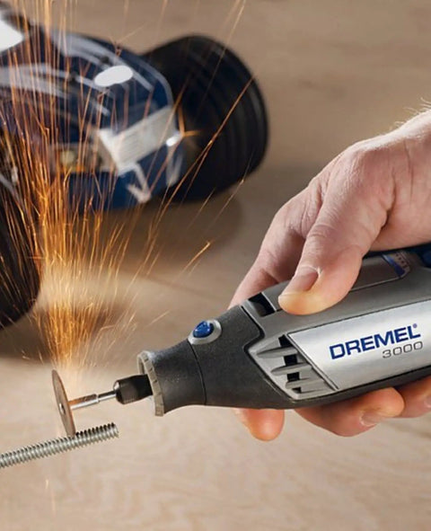 Heavy Duty 130 Watt Rotary Multi Tool Powerhouse Offering Variable Speed Control From 10000 To 33000 Rpm with sparks and metal cutting.