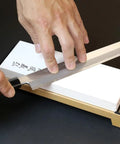 Sharpening a knife on Pro Grade Japanese Whetstone Sharpener 1000 Grit Water Stone For Knives 8x2.85x0.9 Inch.
