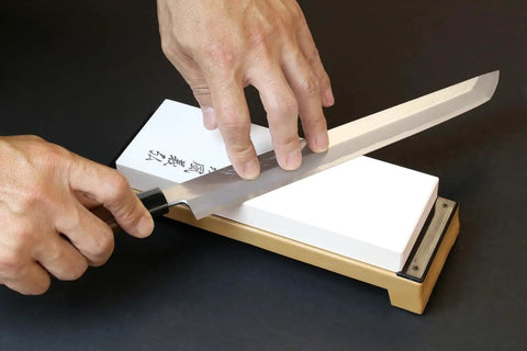 Sharpening a knife on Pro Grade Japanese Whetstone Sharpener 1000 Grit Water Stone For Knives 8x2.85x0.9 Inch.