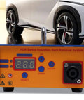 Efficient Electromagnetic Induction Paintless Dent Repair Kit with digital heat control in front of a car tire