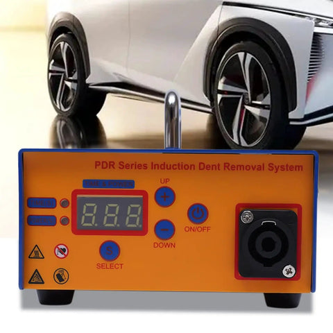 Efficient Electromagnetic Induction Paintless Dent Repair Kit with digital heat control in front of a car tire