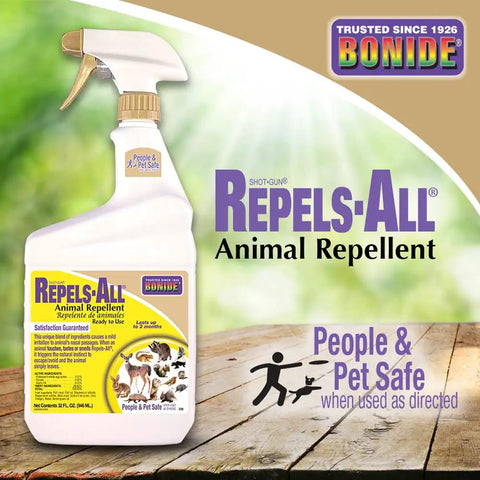 Repels All Animal Repellent Ready To Use Spray 32 Oz displayed with pet-safe label on wooden surface outdoors