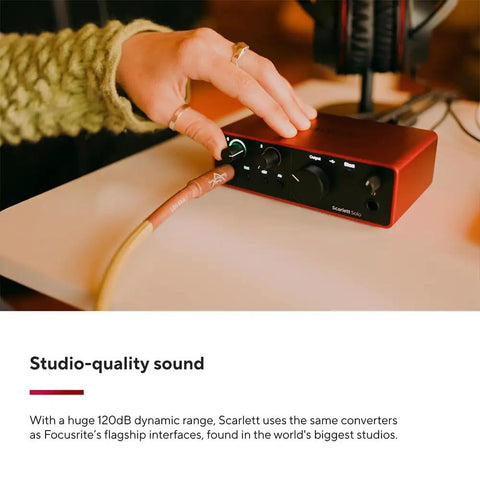 Person adjusting Scarlett Solo 4th Gen Audio Interface Bundle With 2 OnStage MC-20 XLR Cables Pro Vocal Ready USB Recording Gear