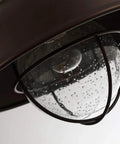 Close-up of Outdoor Farmhouse Ceiling Light 10 Inch Flush Mount in Oil Rubbed Bronze with Metal Cage and Seeded Glass