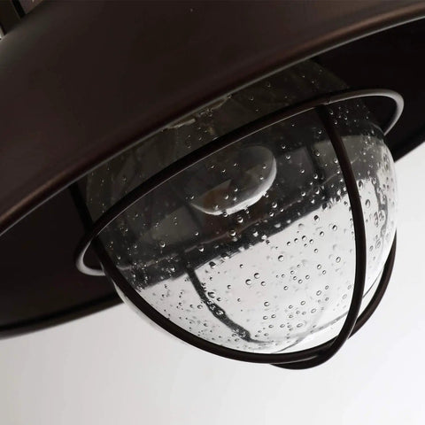 Close-up of Outdoor Farmhouse Ceiling Light 10 Inch Flush Mount in Oil Rubbed Bronze with Metal Cage and Seeded Glass
