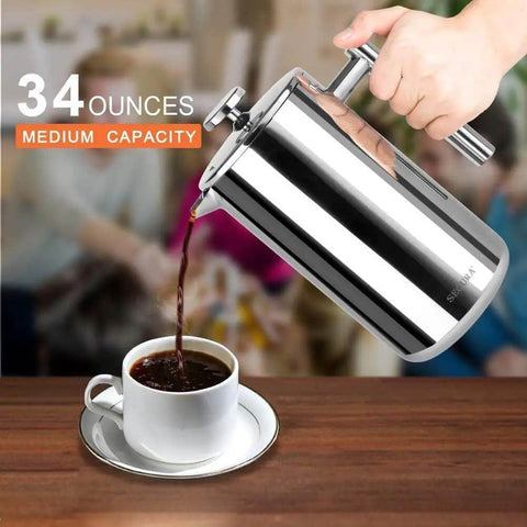 Pouring coffee from 34oz 304 stainless steel French press with insulated double wall carafe into cup