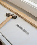 12Pcs Piano Hinges with Smooth Action for Cabinet Doors and Lids shown with hammer and wood plank on surface