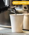 White Disposable Paper Coffee Cups With Lids 24 Oz 50 Count For Hot Beverages Tea Espresso Cocoa To Go Drink Containers shown with coffee machine