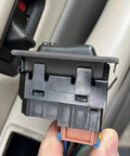 Close-up of 2 Pack Rear Window Switch Trim Replacement for Escalade Avalanche Silverado Tahoe Sierra and Yukon 2000 to 2002 Gray No Window Switch Included Easy Fit Durable Plastic Cover Keeps Interior Looking Clean in use.