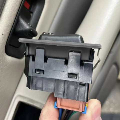 Close-up of 2 Pack Rear Window Switch Trim Replacement for Escalade Avalanche Silverado Tahoe Sierra and Yukon 2000 to 2002 Gray No Window Switch Included Easy Fit Durable Plastic Cover Keeps Interior Looking Clean in use.