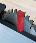 Setup Blocks Height Gauge Set with 1/8 inch aluminum setup bar next to a table saw blade for precise woodworking.