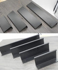 Edge Finger Pulls 2 Pack Hidden Cabinet Handles for kitchen and closet cabinets, aluminum alloy, side view on wooden surface.