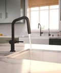 hansgrohe Talis N Pull Down Kitchen Faucet, Modern, Magnetic Hand Sprayer, 1-Handle, 1.75 GPM, Matte Black, 72867671 with flowing water over a white sink.