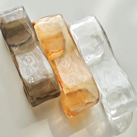 Three stylish glass light shades in brown, amber, and clear colors, ideal for Artpad 19.69‑Inch Modern Ceiling Pendant Light, LED Living Room Lighting.