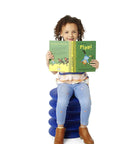 Child sitting on blue stool reading, similar to Active Sitting Stool for Kids Ergonomic Wiggle Friendly Desk Chair in orange for focus.
