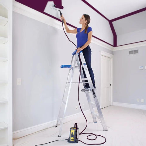 Smart Sidekick Workhorse Power Paint Roller Direct Feed System in use painting a large room ceiling from a ladder.