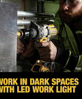 Man using 20V Max XR Brushless Drill/Driver With 3 Speed Modes, Tool Only, DCD991B with LED light in dark space