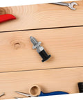 Built Tough Indexing Plunger Pin With Dead Tight Spring Loaded Threaded Design In Premium Stainless Steel for tool locking on wood surface.