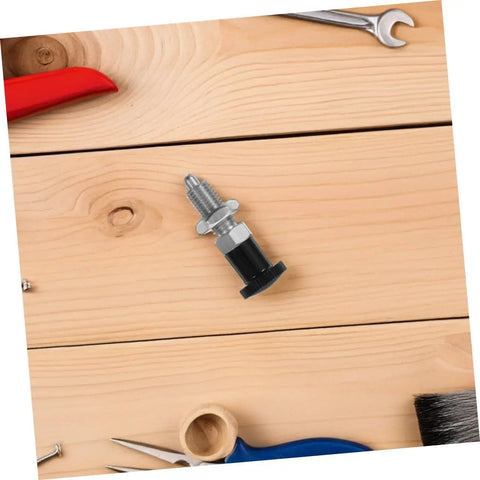 Built Tough Indexing Plunger Pin With Dead Tight Spring Loaded Threaded Design In Premium Stainless Steel for tool locking on wood surface.