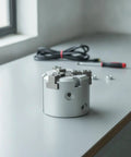 Pneumatic Clamping Chuck With Air Driven Cylinder For Precise Workpiece Grip, Model MHS3-20D, metal body on workshop table