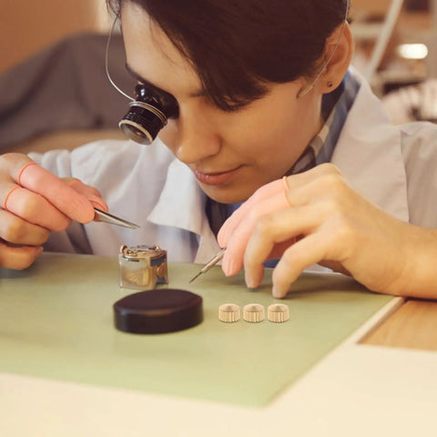 Person using 20 Piece Clock Nut Set For Repair And DIY Projects, Metal Movement Nuts And Gaskets To Stabilize And Regulate Clock Hands