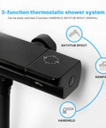 Close-up of black 3-function thermostatic shower system with diagram showing bathtub spout, rainfall, and handheld.