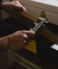 Person using 6 Inch Vernier Caliper Handy Non Digital Tool 0 to 6 Inch 0 to 150mm With 0.05mm Accuracy Carbon Steel on wood