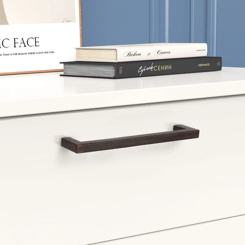 10 Pack Oil Rubbed Bronze Solid Zinc Cabinet Pulls, 5 Inch Center to Center, shown installed on a white cabinet drawer